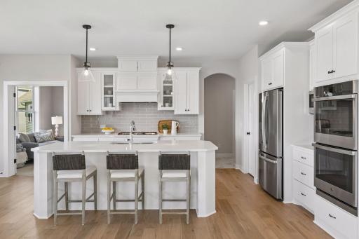 Our gourmet kitchen defines how the WOW comes standard. With a huge center island, granite countertops, gas cook top, and double ovens, plus so much more!