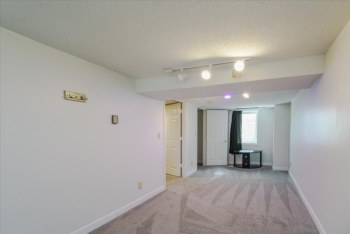 The lower-level bedroom offers potential to create two distinct areas.