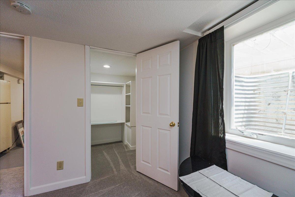 A huge walk-in closet provides ample room for clothing and everyday storage.