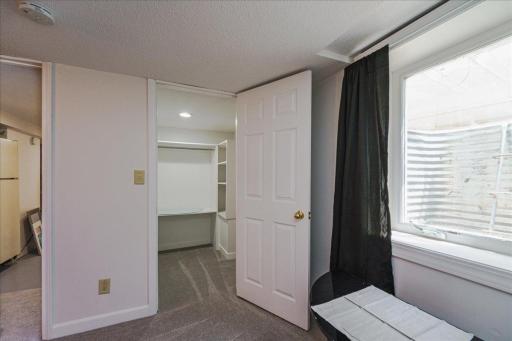 A huge walk-in closet provides ample room for clothing and everyday storage.