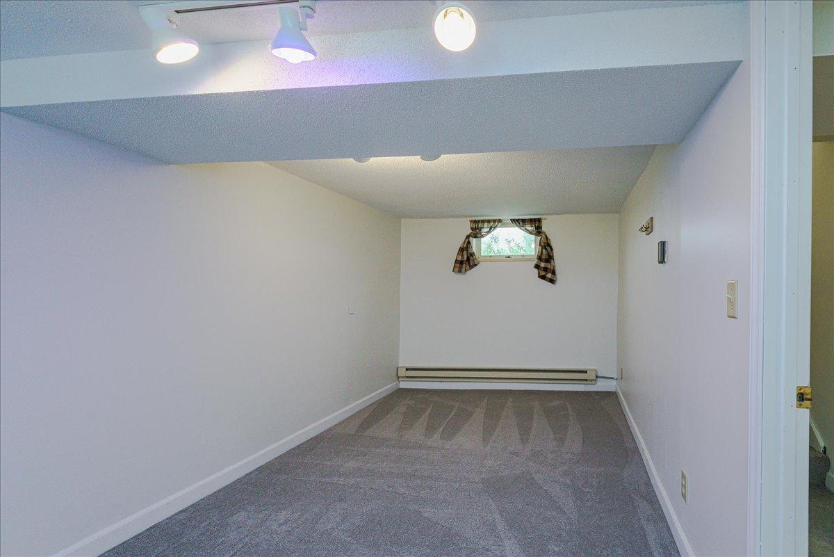 Stretch out in the extended portion of the lower-level bedroom, finished with new carpeting.
