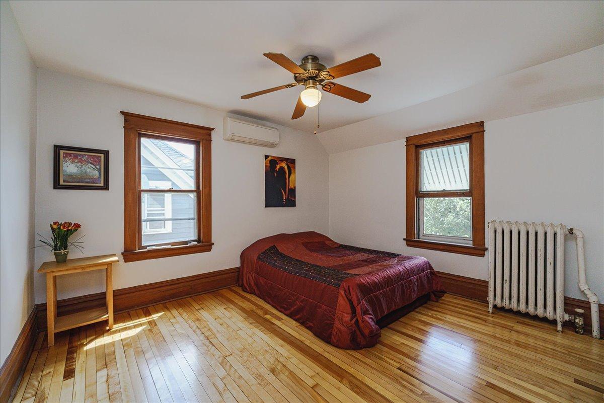 Another spacious upper-level bedroom offers a restful place to unwind.