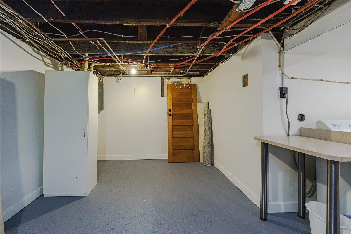 Additional unfinished basement storage helps keep seasonal items and household extras organized.