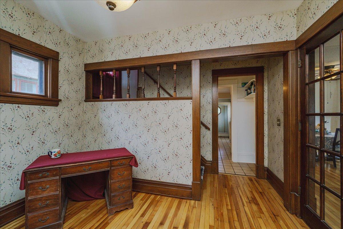 Wood-framed openings showcase the home’s original architectural character.