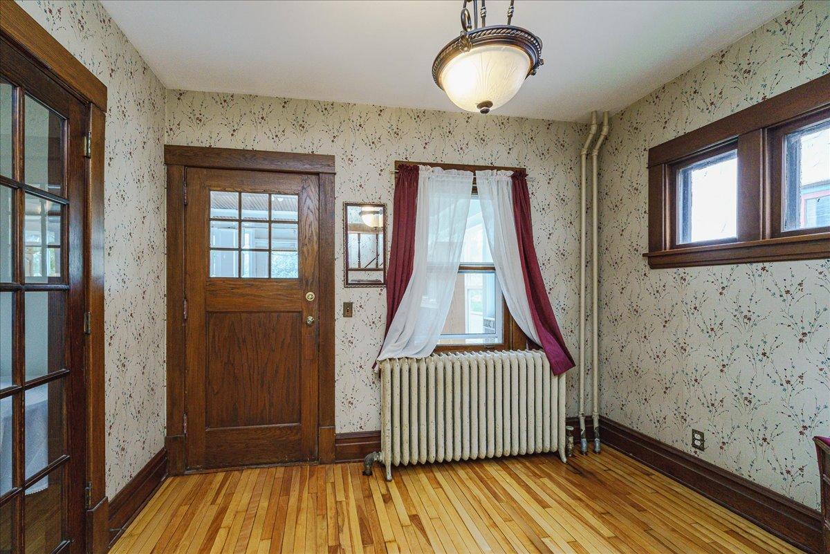 Original woodwork and restored hardwood floors create a memorable interior.