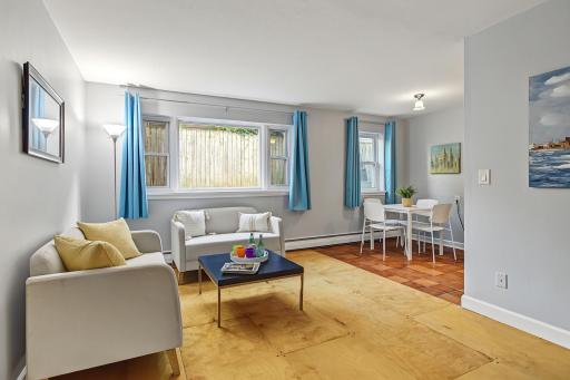 Big window for natural light and unique hardwood floor
