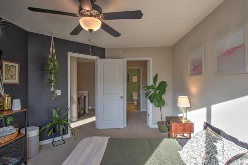 Primary bedroom with views of walk thru closet and private bathroom