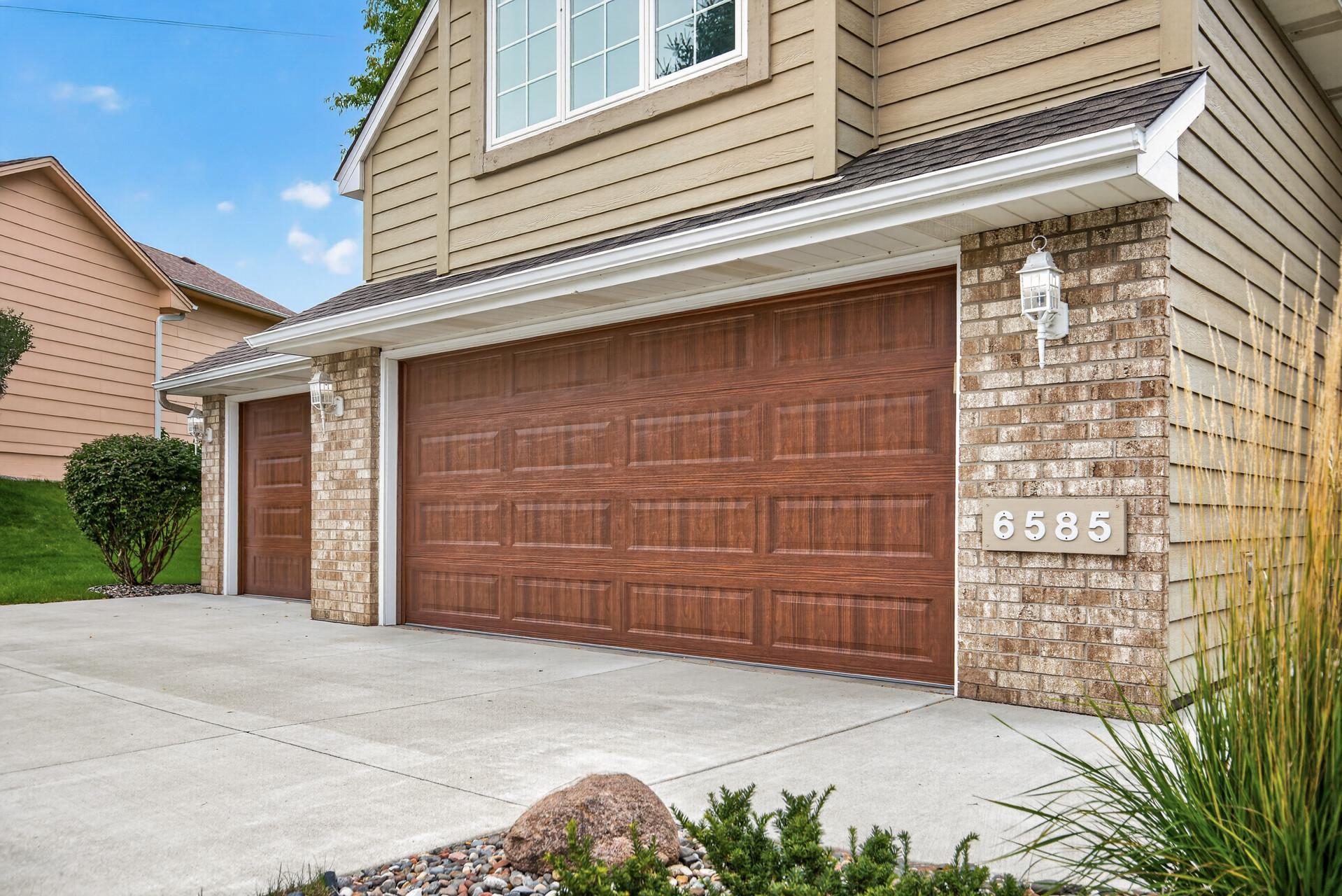 3 Car Finished Garage with Insulated Doors.