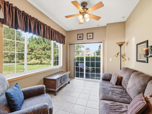 Den/Sunroom with patio access overlooking lake