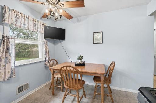 Informal dining area is conveniently located within the kitchen and features a large window.