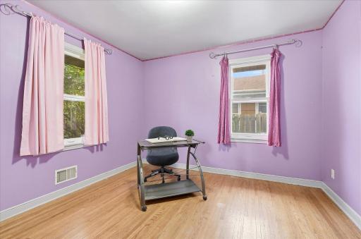 Bedroom #3 highlights the hardwood flooring, spacious closet, and versatile layout with room for bedroom furniture or a home office setup.