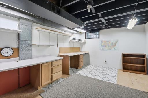 Currently featuring a workshop, multiple workbenches, cabinetry, and abundant storage, this versatile area offers endless possibilities for future finishing, additional living space, or hobbies.
