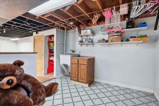 The spacious lower level offers plenty of room to grow, with generous unfinished space ready for your ideas.