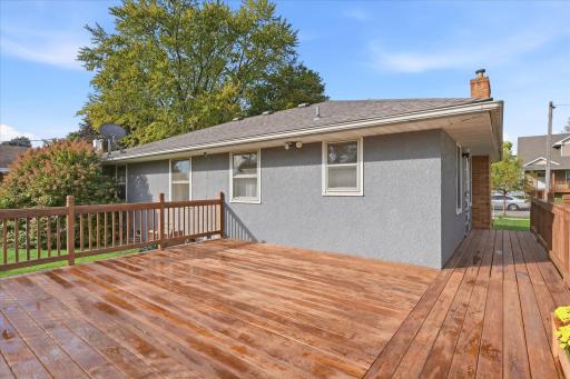 Generously sized deck with plenty of space for outdoor furniture and gatherings, plus convenient access to the home and backyard.