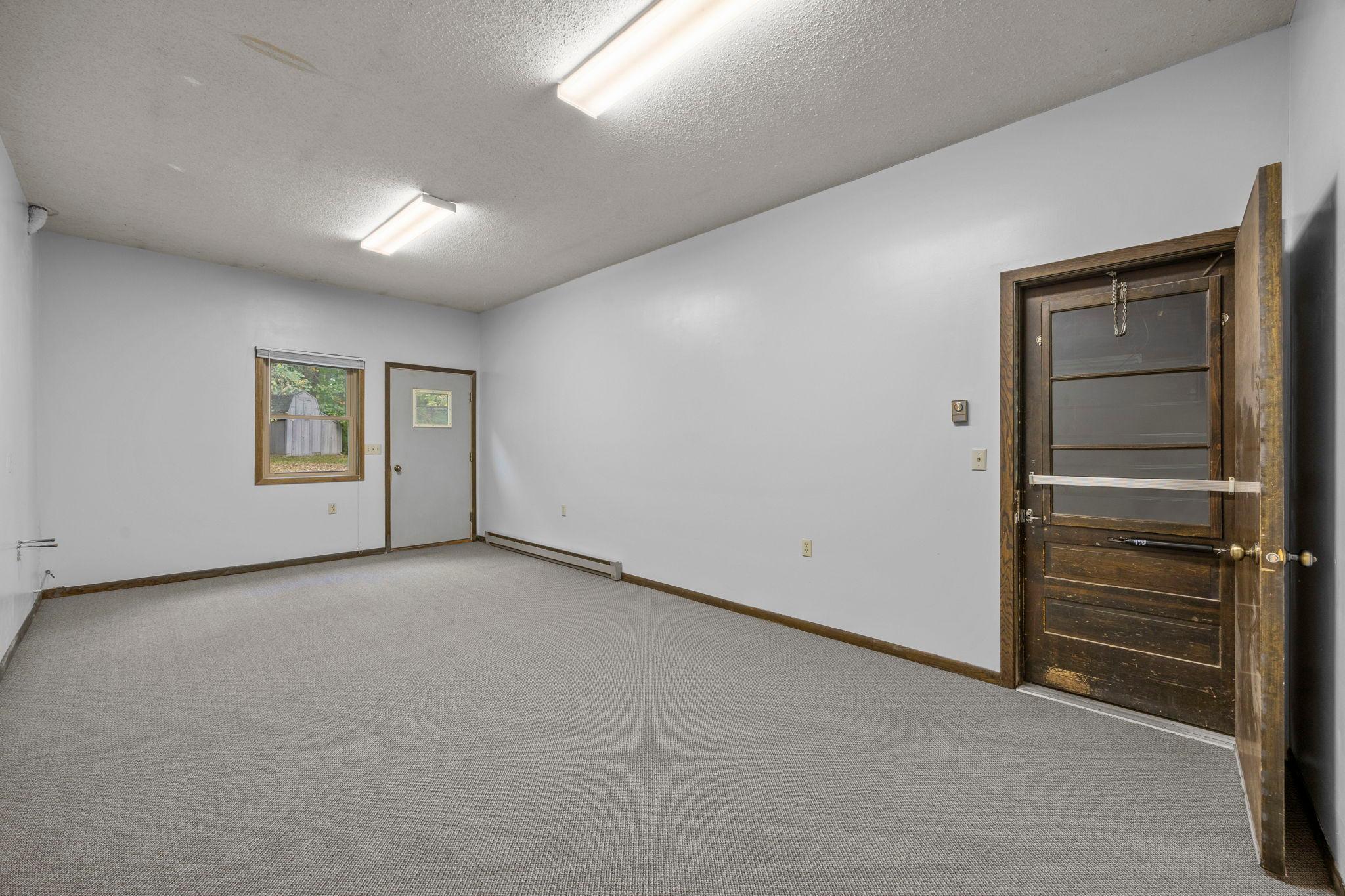 This room off the garage has its own entry door and is fully finished and heated. Was used for an office but can be used for whatever your need is.