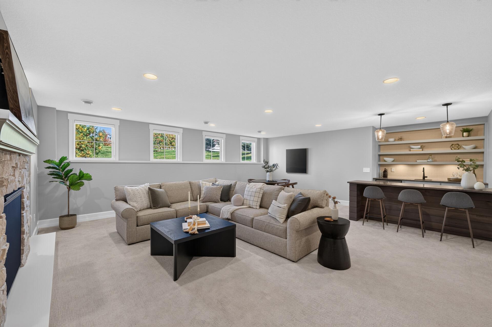 Spacious Lower Level Family Room includes Gas Fireplace and Wet Bar. In-Floor Heat runs throughout the lower level and ensures comfort in any season