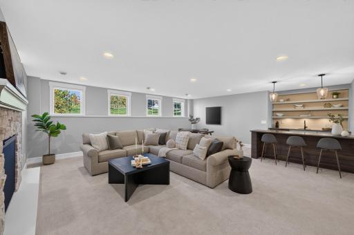 Spacious Lower Level Family Room includes Gas Fireplace and Wet Bar. In-Floor Heat runs throughout the lower level and ensures comfort in any season