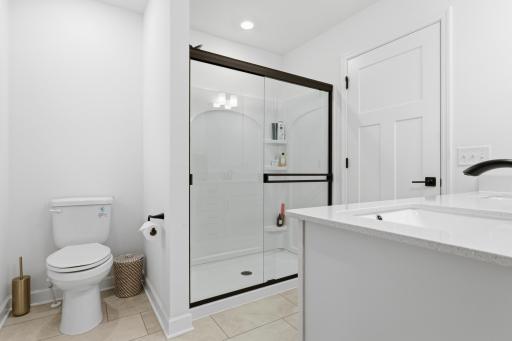 Stylish primary bath featuring a spacious walk-in shower, modern finishes, and a clean, contemporary design.