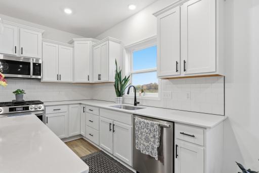 The heart of the home, offering a large center island, stylish cabinetry, and premium finishes buyers will love.