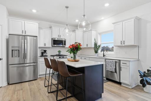 Open-concept kitchen designed for modern living, featuring a large island, abundant storage, and contemporary style