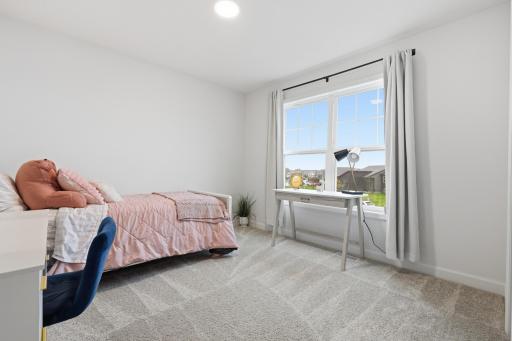 Bright and spacious bedroom filled with natural light, offering a comfortable retreat for rest, study, or work-from-home flexibility.