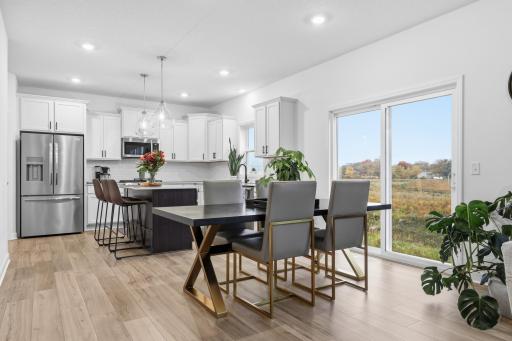 Enjoy meals with a view in this bright dining area overlooking scenic natural surroundings and open green space.