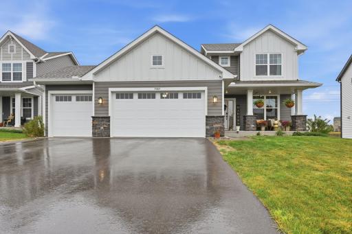 Stunning curb appeal with modern farmhouse-inspired design, stone accents, and a welcoming front porch you'll love coming home to.