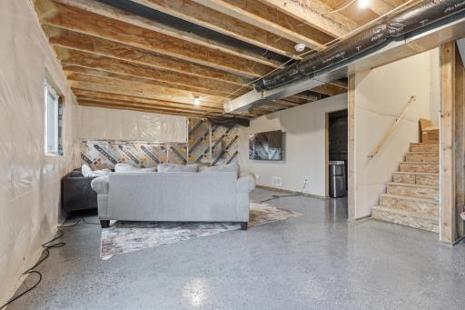 The unfinished walkout basement offers endless possibilities for future living space, a home office, gym, or recreation area.