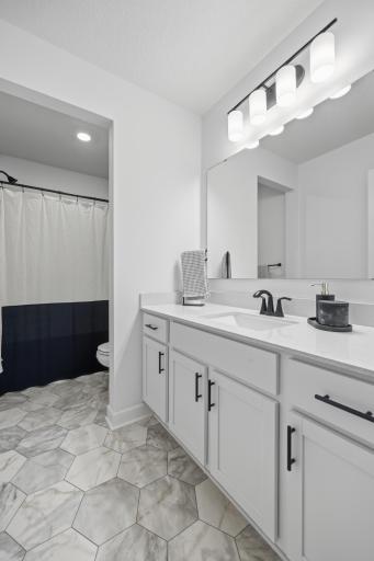 Modern full bath with upscale finishes and a spacious double vanity, creating the perfect blend of luxury and functionality.