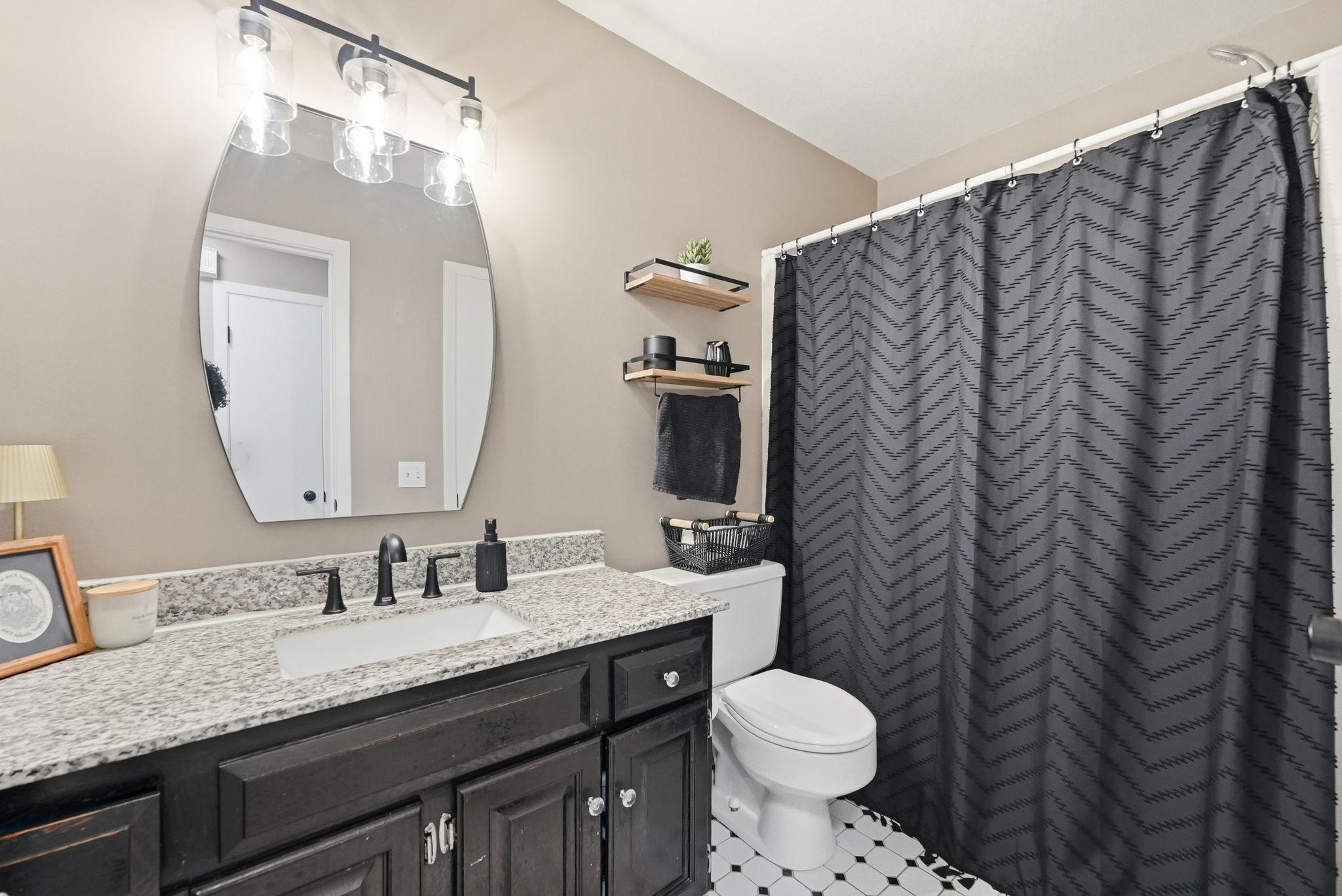 Updated bath with granite vanity