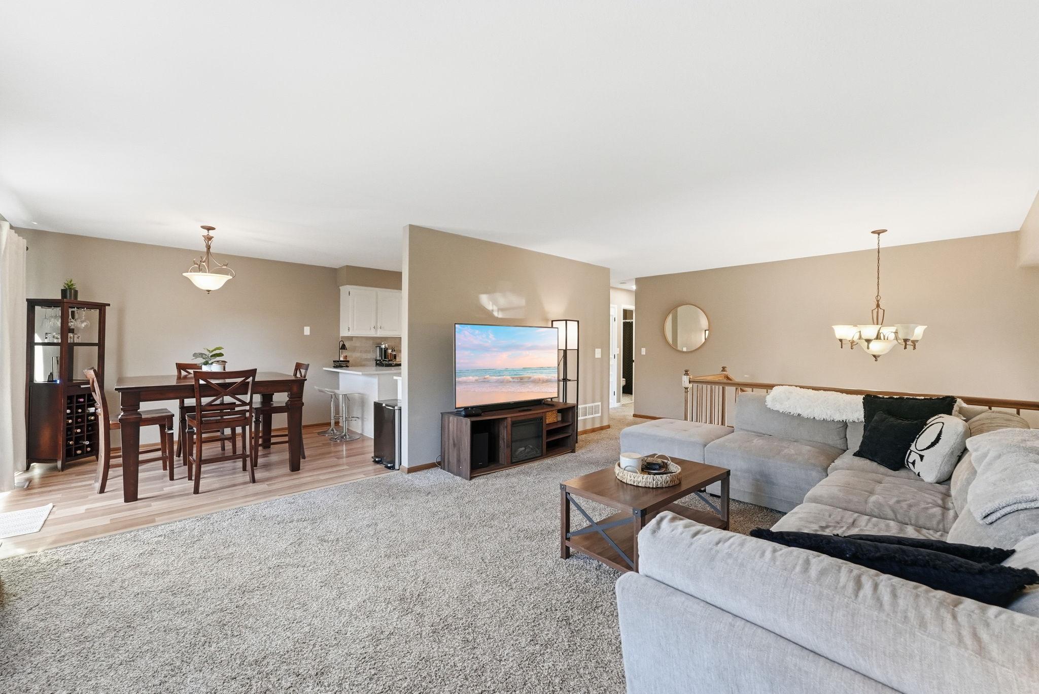 Living room flows into dining and kitchen