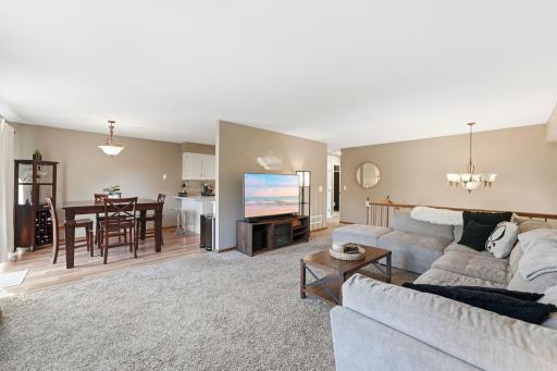 Living room flows into dining and kitchen
