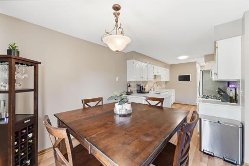 Kitchen, dining room, and deck - new lighting fixtures & flooring in 2023