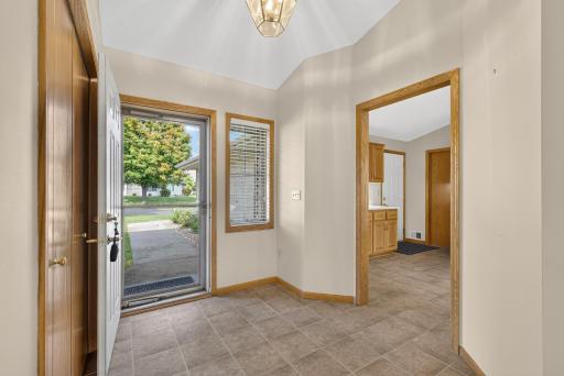Foyer with large closet and easy care tile floors.