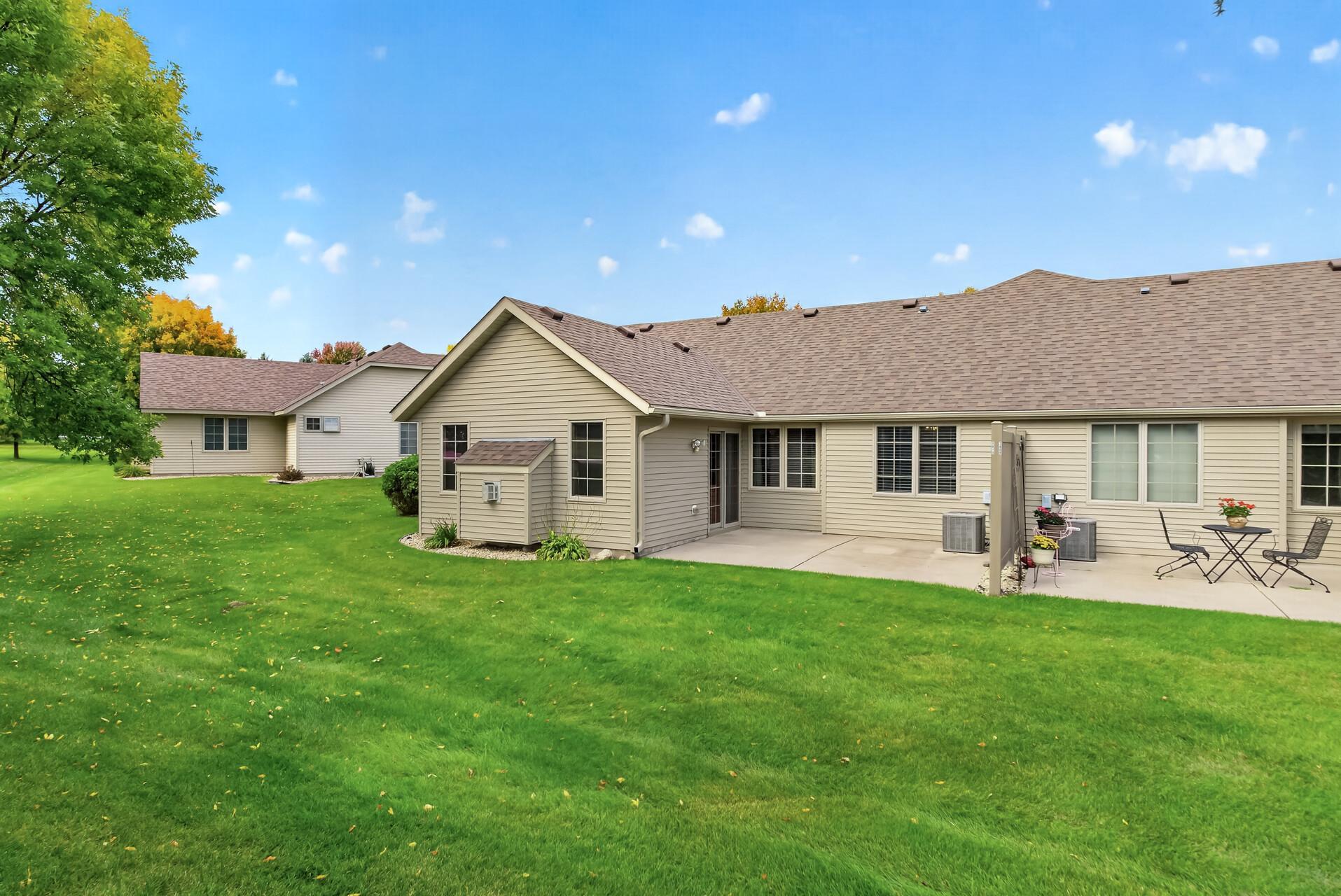 Spacious back Patio with privacy divider between neighbors.