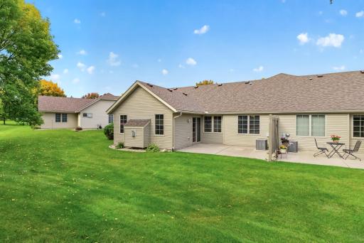 Spacious back Patio with privacy divider between neighbors.