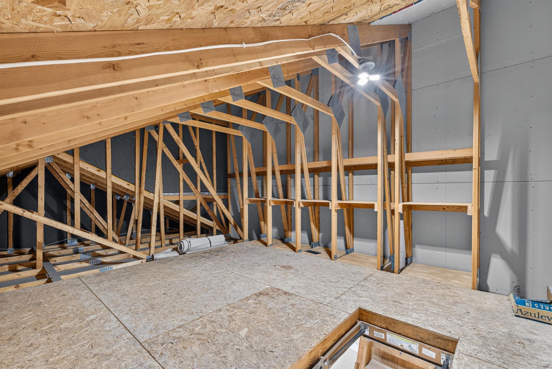 Upper Level storage w/built in shelving and floor.