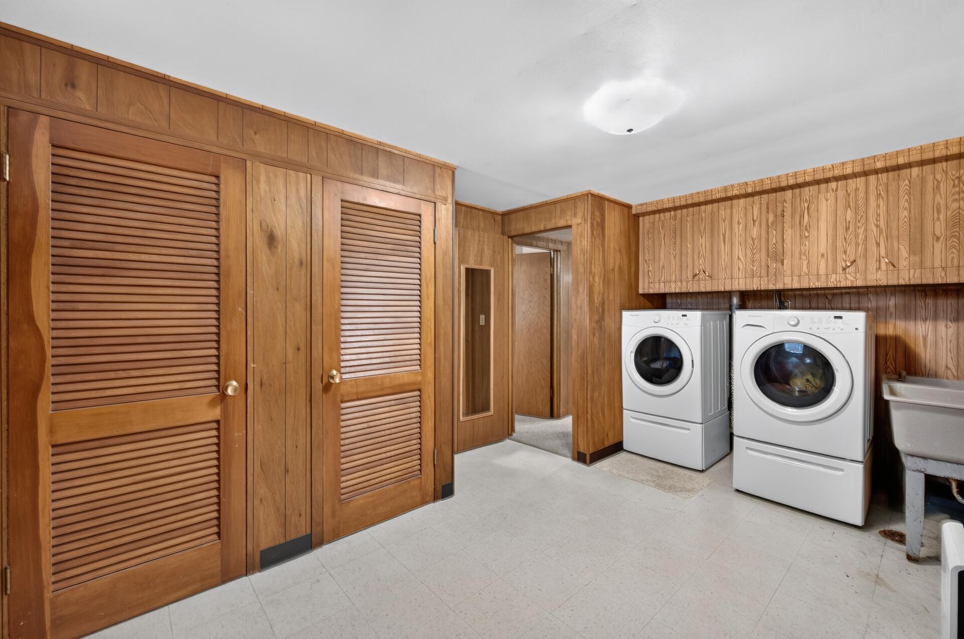 Spacious Laundry Room with Laundry Shoot