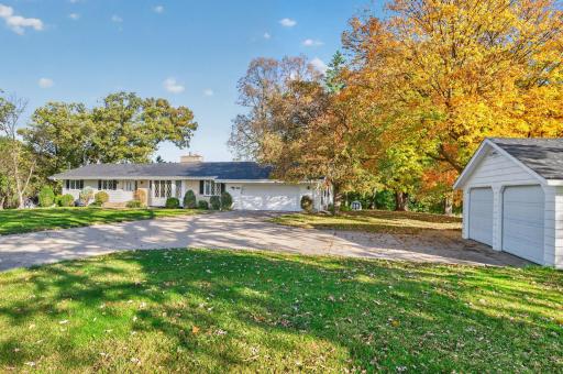 Enjoy the long concrete driveway with access to both your attached and unattached garage