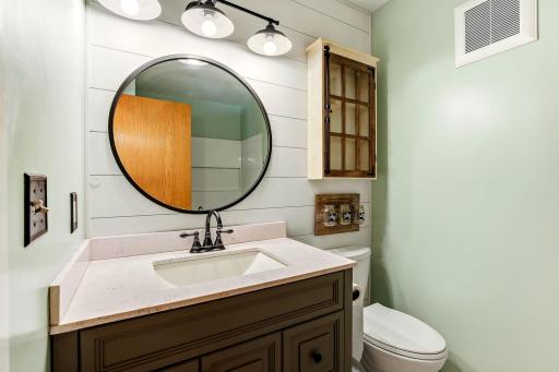Fresh, bright full bath featuring updated finishes and a clean, modern feel on the upper level.
