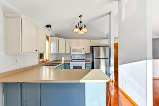 Freshly painted cabinetry delivering a clean, modern look with crisp lines and a bright, refreshed finish throughout the kitchen.