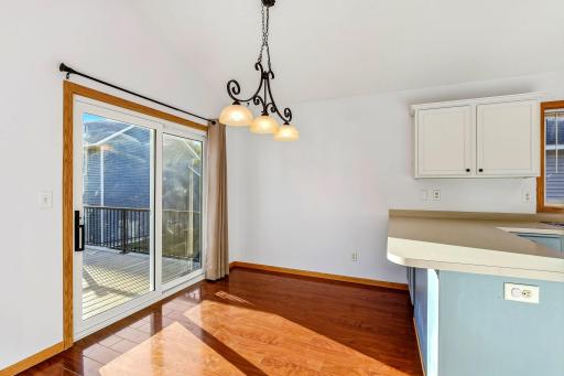 Bright dining area with a seamless walkout to the maintenance-free deck, creating an easy indoor-outdoor flow perfect for everyday living and entertaining.