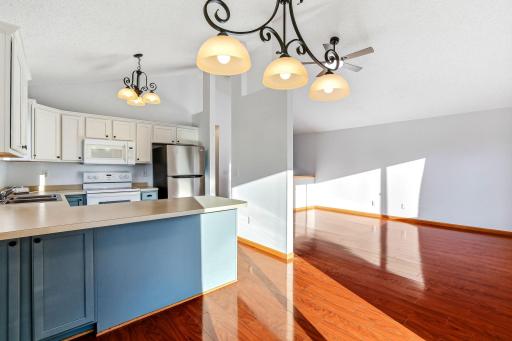 Connected kitchen-dining layout offering bright flow, easy everyday functionality, and a comfortable space for gathering.