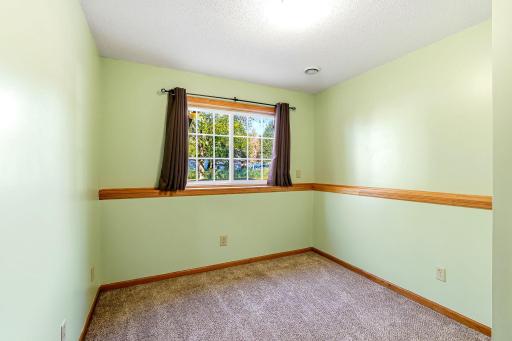 Comfortable lower-level bedroom offering privacy, flexibility, and a bright, functional space within the homeâs expanded layout.