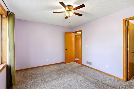 Bright, comfortable primary suite featuring a spacious walk-in closet for organized, convenient everyday living.