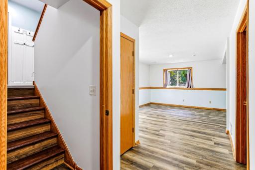 Durable, low-maintenance vinyl flooring on the lower level, creating a clean, updated look with comfortable everyday function.