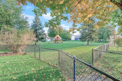 Welcoming community space featuring a fun, well-maintained play set, perfect for outdoor enjoyment and neighborhood gathering.