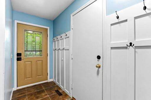 Stylishly upgraded entry featuring custom board-and-batten detailing and practical coat hooks, creating a polished, organized, and welcoming first impression.