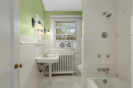 Full bathroom on upper level with pedestal sink