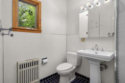 Ensuite 3/4 bath attached to main floor bedroom